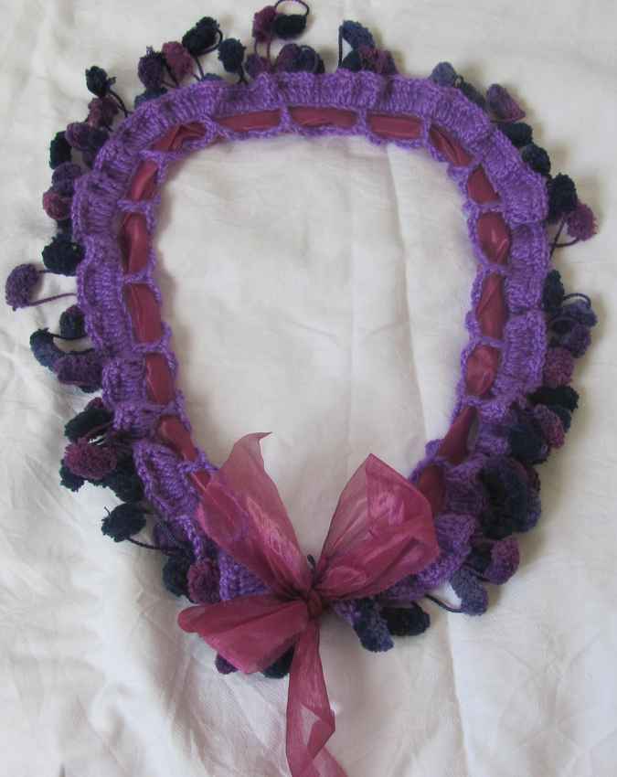 large image of art item: accessory &ndash; crochet purple ponpons ribbon