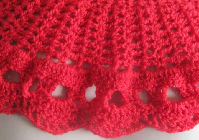 large image of art item: red crocheted capelet with golden button