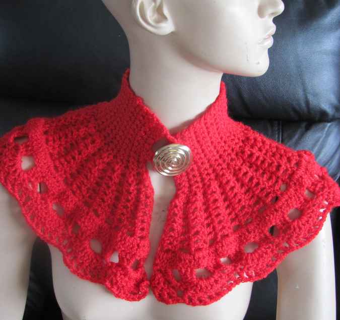 large image of art item: red crocheted capelet with golden button