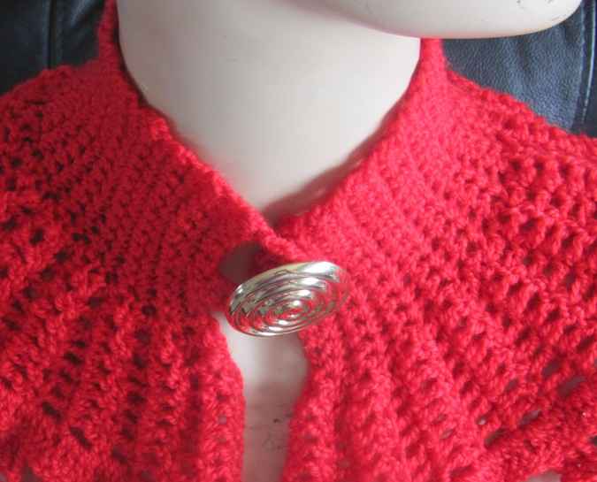 large image of art item: red crocheted capelet with golden button