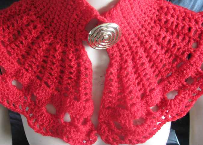 large image of art item: red crocheted capelet with golden button