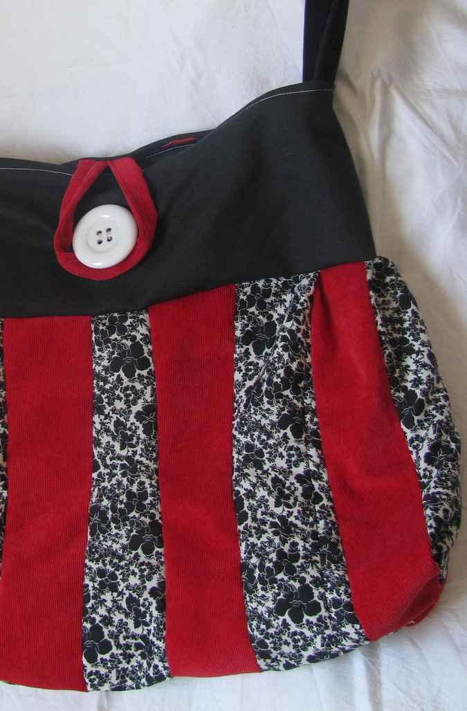 large image of art item: bag &ndash; black stripes red black button white