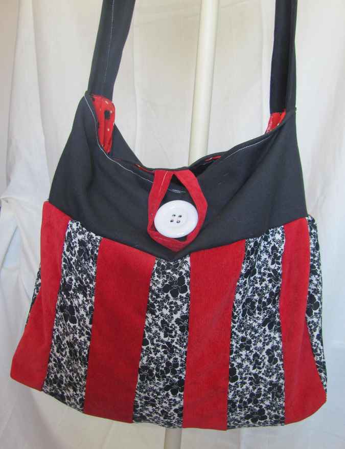 large image of art item: bag &ndash; black stripes red black button white