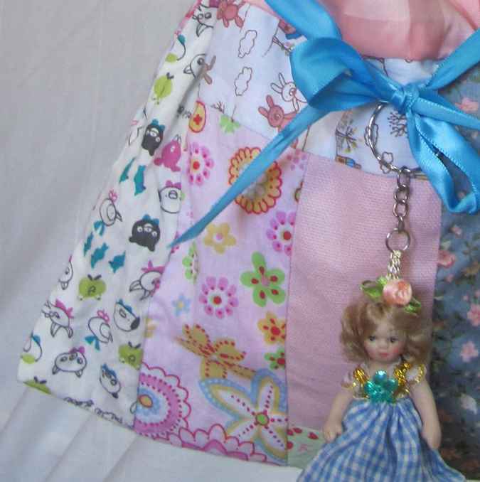 large image of art item: bag &ndash; doll and blue ribbon