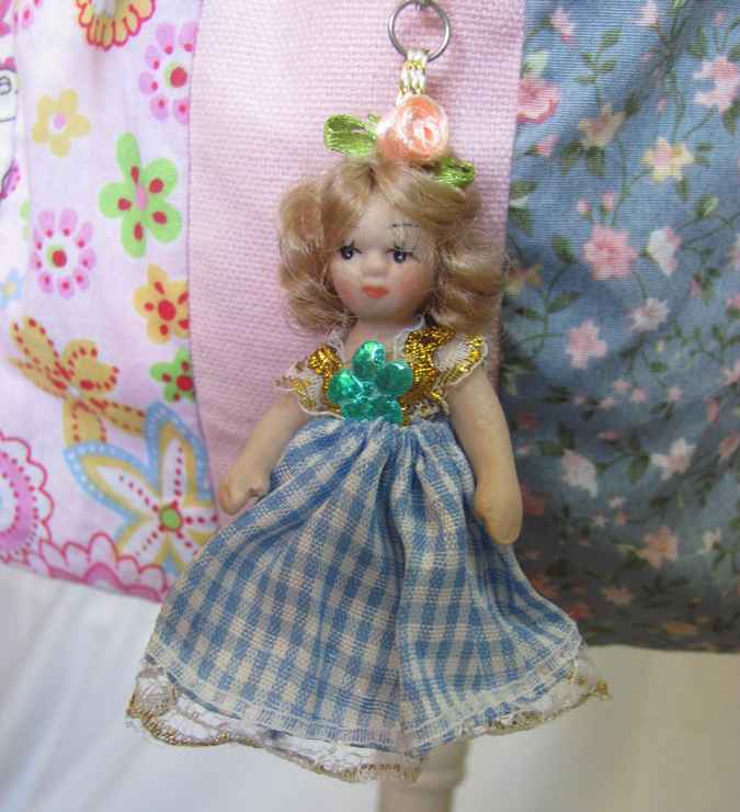 large image of art item: bag &ndash; doll and blue ribbon