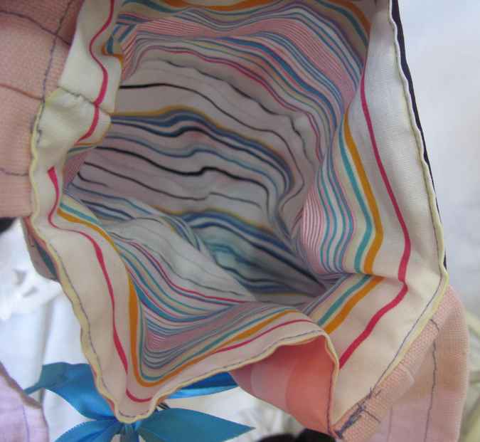 large image of art item: bag &ndash; doll and blue ribbon