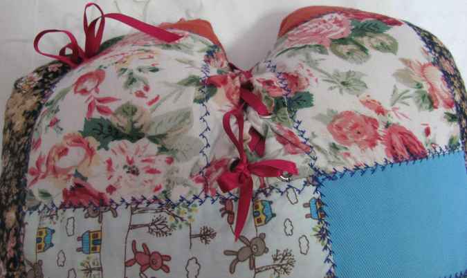 large image of art item: heart shaped quilted pillow with ribbon