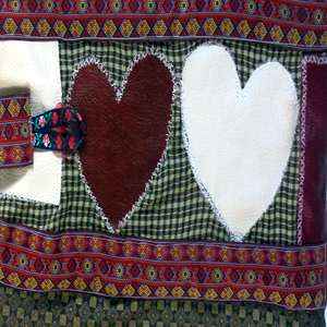 motif of two leather quilted hearts on a quilt bag