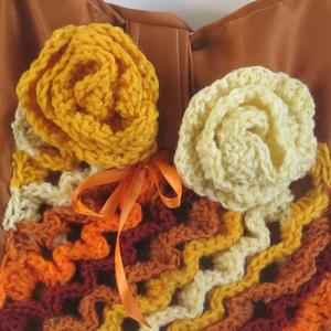 crocheted flowers and geometric patterns on a bag