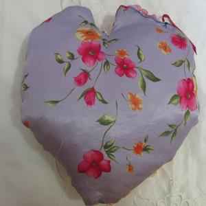 heart shaped quilted pillow with ribbon